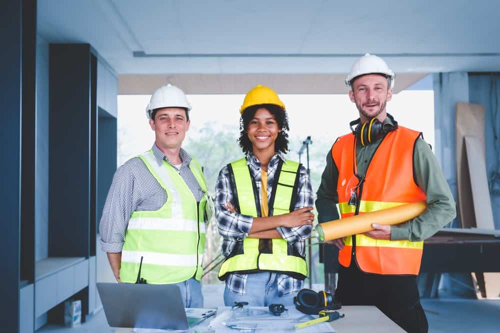 Group Of Multi Ethnic Engineer Construction Site Worker Meeting At Table