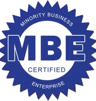 A blue circular badge with a jagged edge reads "MINORITY BUSINESS ENTERPRISE" around the border and "MBE CERTIFIED" in large letters in the center.